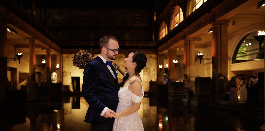 Wedding Couple beside the torchlit Great Bath